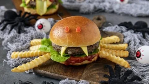 Three Halloween burgers designed for a spooky-themed feast.