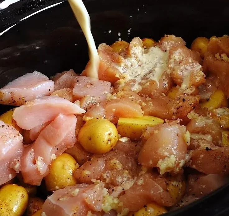 Slow Cooker Parmesan Garlic Chicken served with potatoes for a hearty meal