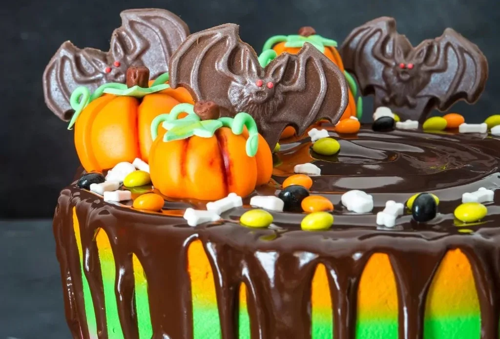 Spooky Halloween cake decorated with ghosts and pumpkins for festive celebrations
