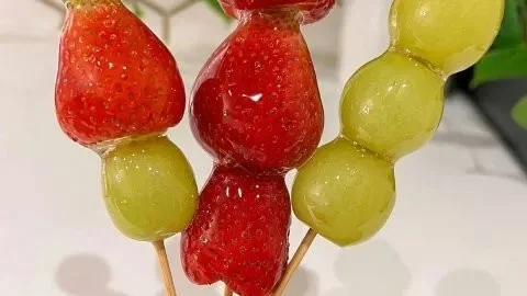 Tanghulu - Chinese candied fruit recipe with vibrant berries on skewers
