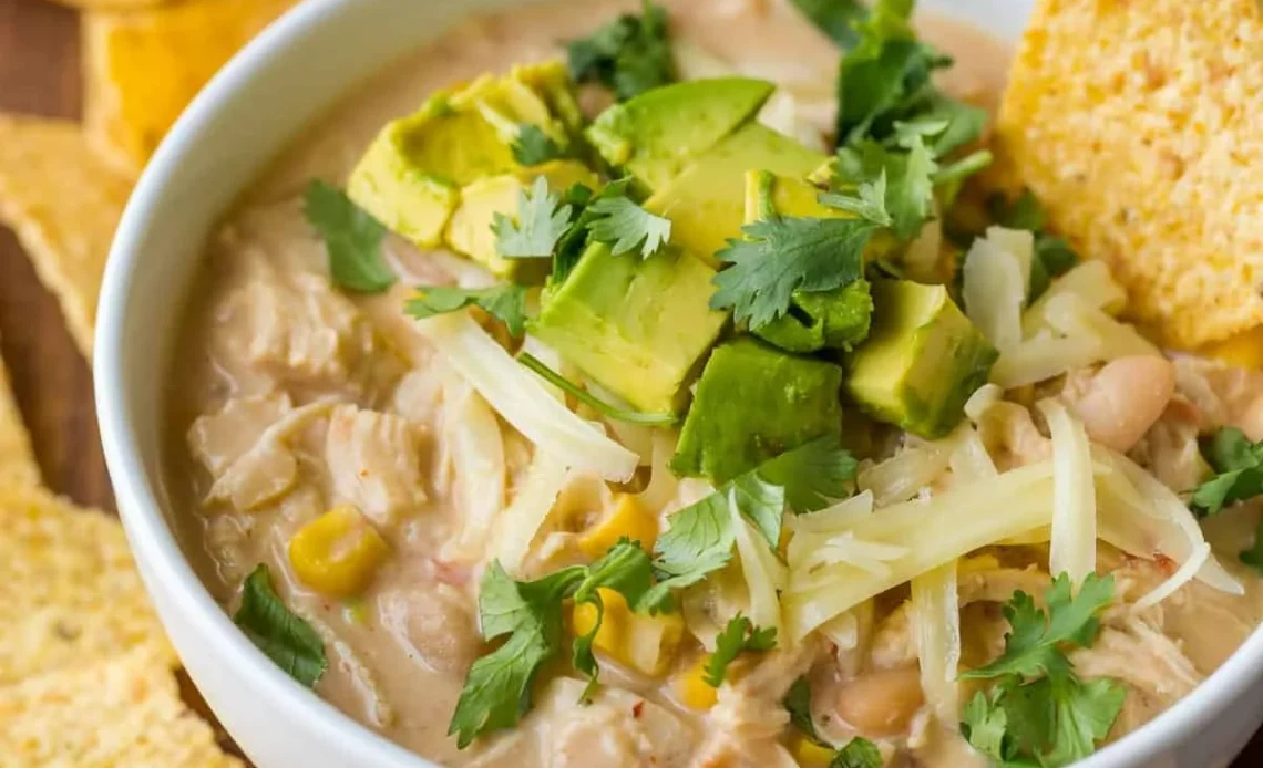 Bowl of delicious homemade chicken chili topped with fresh cilantro