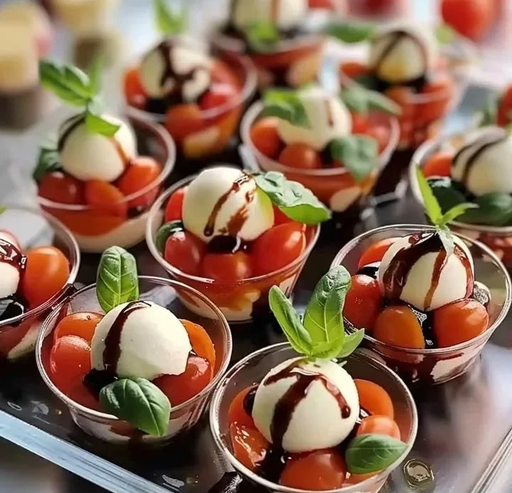 Christmas Mini Caprese Salad Cups with tomatoes, mozzarella, and basil