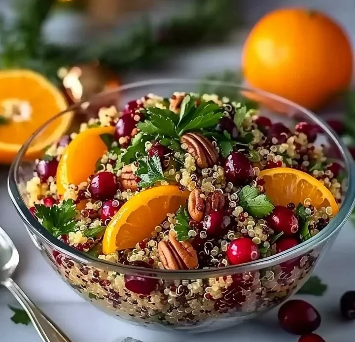 Festive Christmas Orange Cranberry Quinoa Salad with vibrant ingredients.