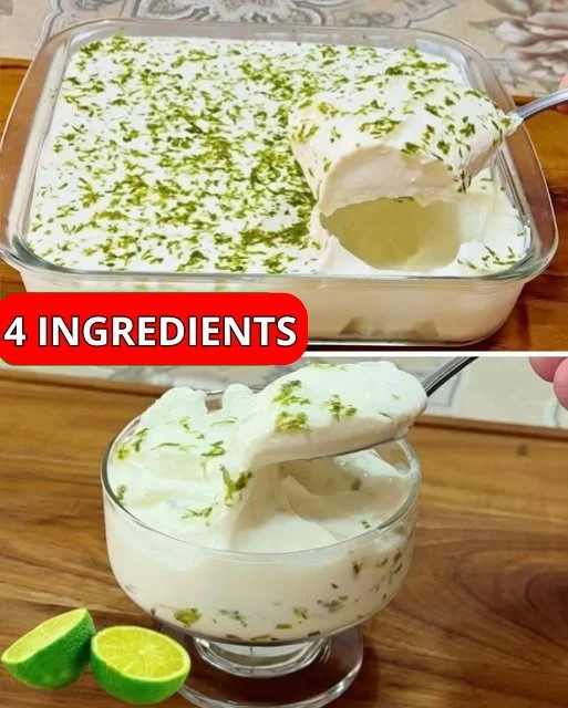 Bowl of creamy lemon mousse topped with a slice of lemon and mint leaves