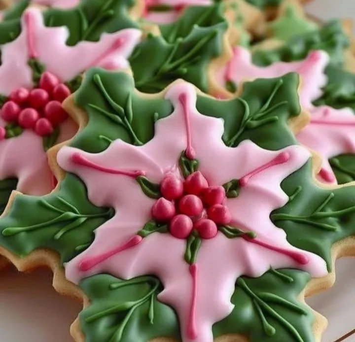 Holly-decorated sugar cookies with festive colors and edible decorations.
