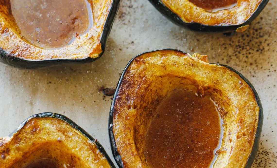 Maple roasted acorn squash dish garnished and served on a plate