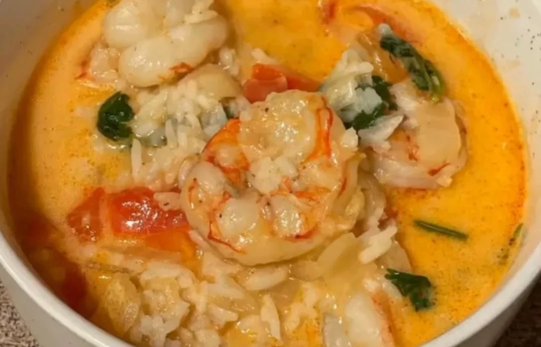 Bowl of flavorful Shrimp Thai Soup with herbs and spices
