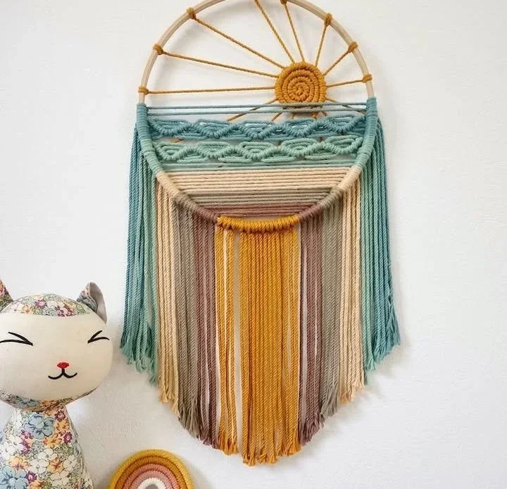 Colorful macrame wall hanging art made from vibrant cords.