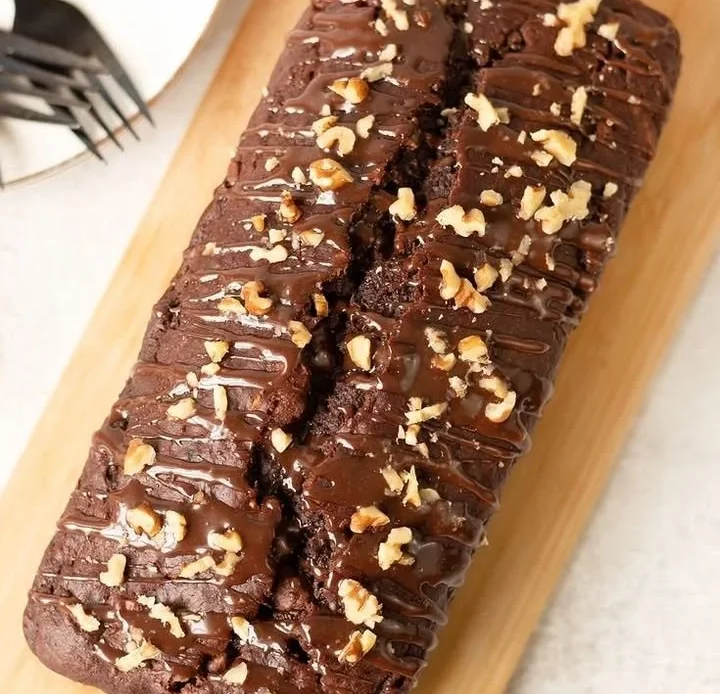Delicious homemade chocolate banana bread slice on a wooden board