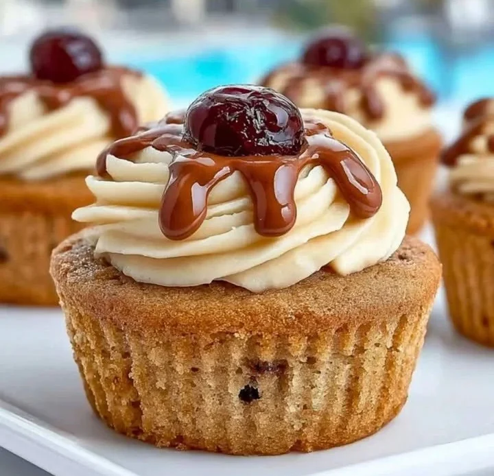 Chocolate chip cupcakes with caramel buttercream and cherry topping