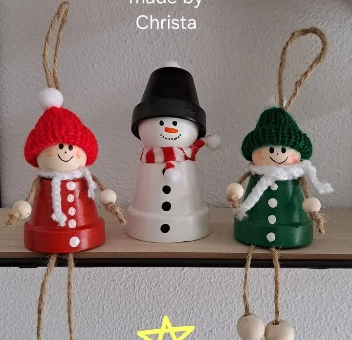 DIY Christmas figurines made from painted clay pots and yarn accessories.