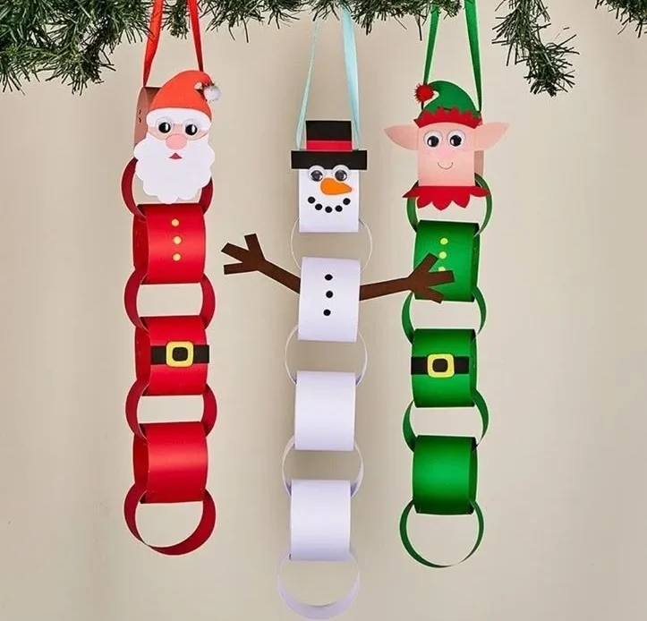 DIY Christmas paper chains shaped like Santa, snowman, and elf decorations.