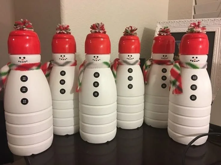 DIY Christmas snowmen made from recycled plastic bottles and red caps