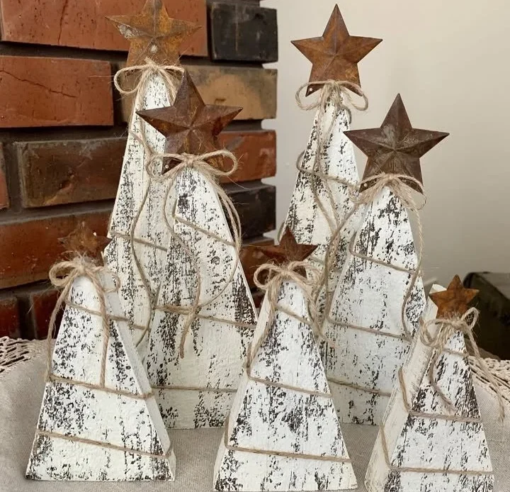 DIY rustic Christmas trees made from painted wood and twine.