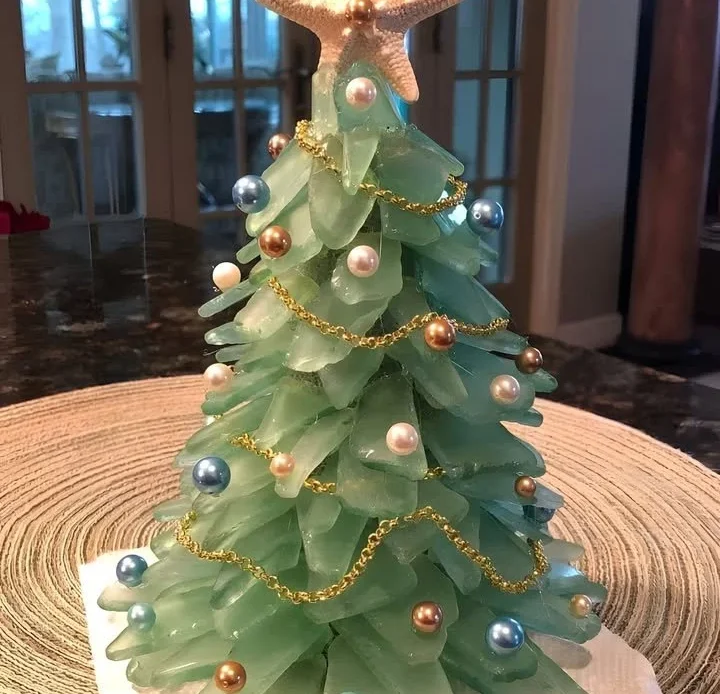 Elegant sea glass Christmas tree craft showcasing colorful glass pieces.