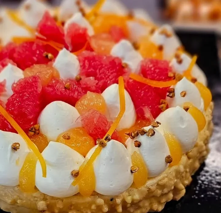A vibrant grapefruit with buckwheat and almonds, highlighting healthy eating choices.