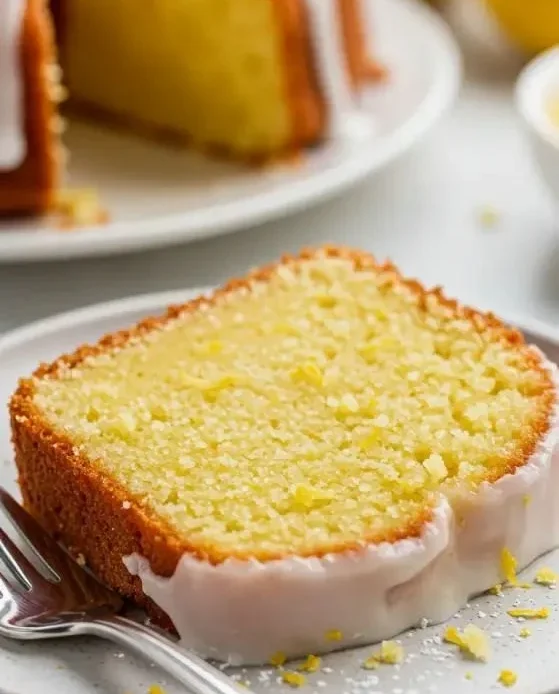 Freshly baked lemon pound cake slice on a plate